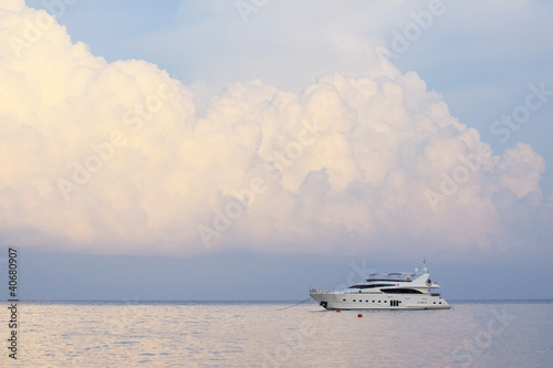 Photo: white yatch and plain sea blue sky white clouds white yatch and plain sea blue sky white clouds