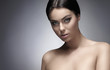 Portrait of a young and beautiful naked brunette woman