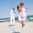 Summer fun - family playing at the beach
