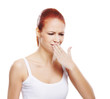 A young and attractive Caucasian redhead woman coughing