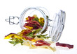 Colorful dry pasta in a jar on white background Colorful dry pasta in a jar on white background