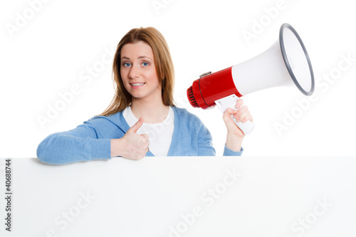 Photo: motivierte frau mit megafon und hinweisschild motivierte frau mit megafon und hinweisschild