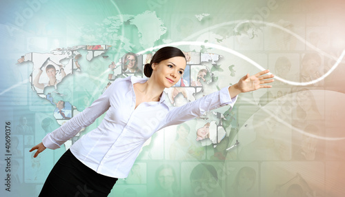 Photo: Business person against technology background Business person against technology background