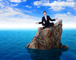 Businessman in suit praying for success