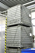 clean shiny chemical containers placed one over another at the w