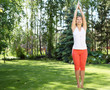 Photo: Young girl in a white shirt and red pants Young girl in a white shirt and red pants