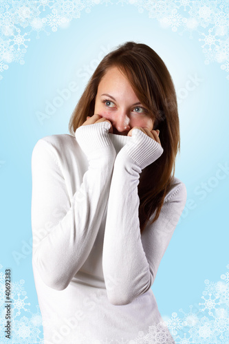 Photo: Young girl in white sweater Young girl in white sweater