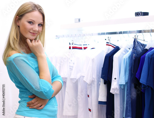 Photo: Woman in a shop buying clothes Woman in a shop buying clothes