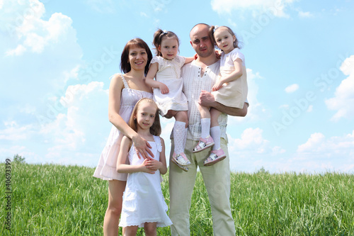 Photo: family with children in summer day outdoors family with children in summer day outdoors