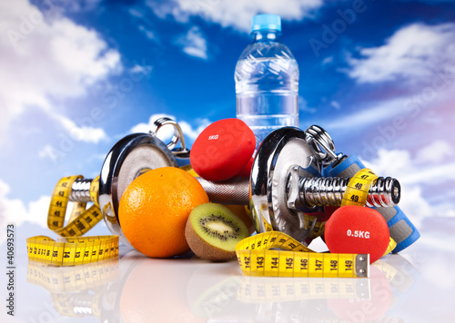 Photo: fitness dumbbells, hand grip, water and fruits fitness dumbbells, hand grip, water and fruits