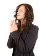 praying young woman with folded hands, white background