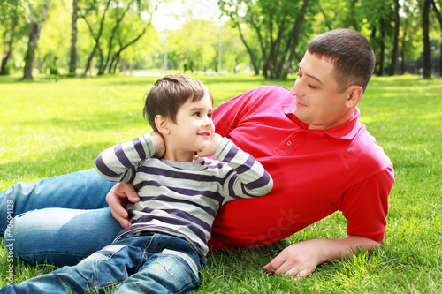 Photo: Father with his son in the park Father with his son in the park
