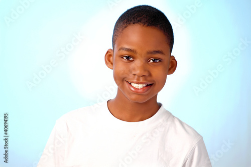 Photo: Cute smiling boy in horizontal with copy space Cute smiling boy in horizontal with copy space