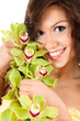 beautiful girl with orchid flowers, white background