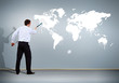 Businessman with paint brush and world map Businessman with paint brush and world map