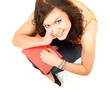cheerful student girl with book looking at camera
