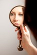 Closeup Mirror Reflection of a Woman's Face