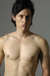 Sport and health body of man. Isolated on gray