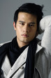 A fashion man a winter jacket and scarf