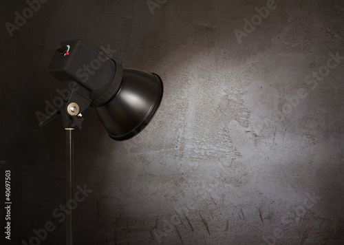 Photo: spot light on concrete wall spot light on concrete wall