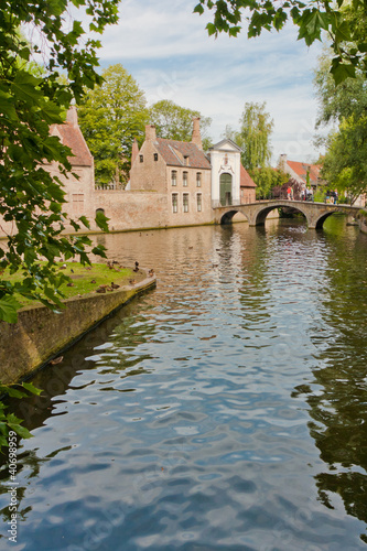 Photo: Bruges (Brugge), the beguinage and canal Bruges (Brugge), the beguinage and canal
