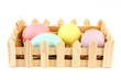 Basket of easter eggs over white