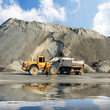 Excavator and truck in mine.