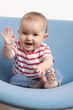 happy baby playing peek a boo