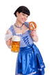 Junge Frau im Dirndl mit Bierkrug und Brezel