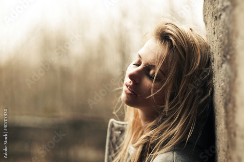Photo: beautiful girl near the wal beautiful girl near the wal