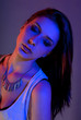 Beautiful girl posing in front of colored creative lighting Beautiful girl posing in front of colored creative lighting