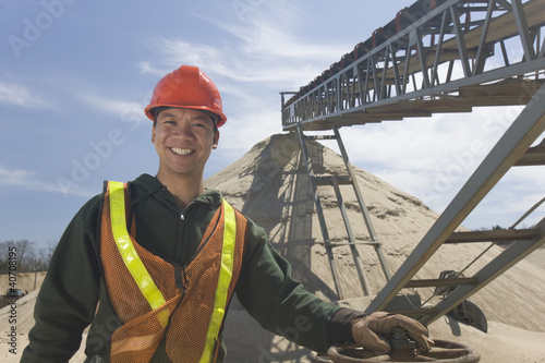 Photo: Engineer standing at a gravel and asphalt plant Engineer standing at a gravel and asphalt plant