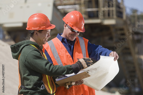 Photo: Two engineers planning at a gravel and asphalt plant Two engineers planning at a gravel and asphalt plant