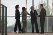 Photo: Business executives shaking hands Business executives shaking hands
