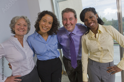 Photo: Portrait of business executives smiling together Portrait of business executives smiling together