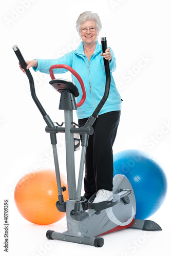 Photo: senior woman exercising on stepper senior woman exercising on stepper
