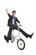 Happy asian businessman on a bicycle isolated Happy asian businessman on a bicycle isolated