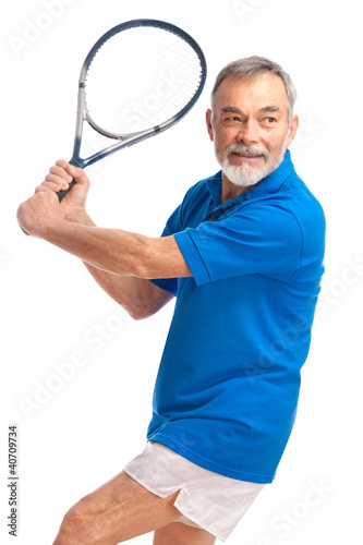 Photo: senior man playing tennis senior man playing tennis