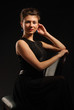 Portrait of the brunette on a chair Portrait of the brunette on a chair