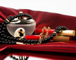 Perfume bottle, red lipstick and pearls beads