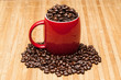 Red cup with whole coffee beans