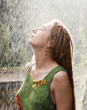 Photo: Woman refreshing in the rain Woman refreshing in the rain