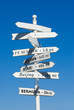 White direction sign post