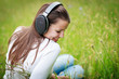 portrait of a pretty young woman listening to music on her mp3 p