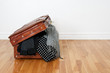Photo: Polka dot clothing in a retro suitcase Polka dot clothing in a retro suitcase