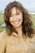 Photo: A happy smiling mature woman with freckles. A happy smiling mature woman with freckles.