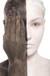 woman in two-color makeup covers eye with hand woman in two-color makeup covers eye with hand