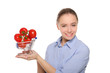 branch with tomatoes in trolley on the women palm branch with tomatoes in trolley on the women palm