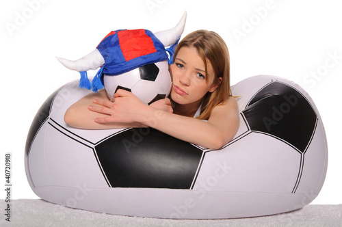 Photo: Distressed football cheerleader with ball Distressed football cheerleader with ball
