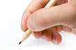 Writing. An hand who writes in a paper sheet with a pencil Writing. An hand who writes in a paper sheet with a pencil